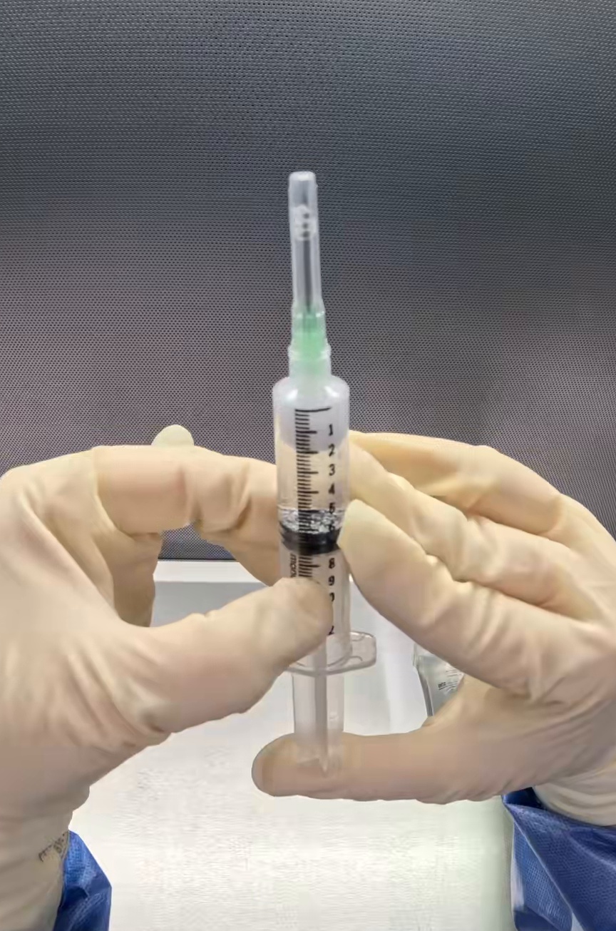 Center Drug-filled syringe